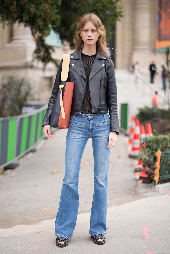 Томбои chic in flare jeans and a leather jacket
