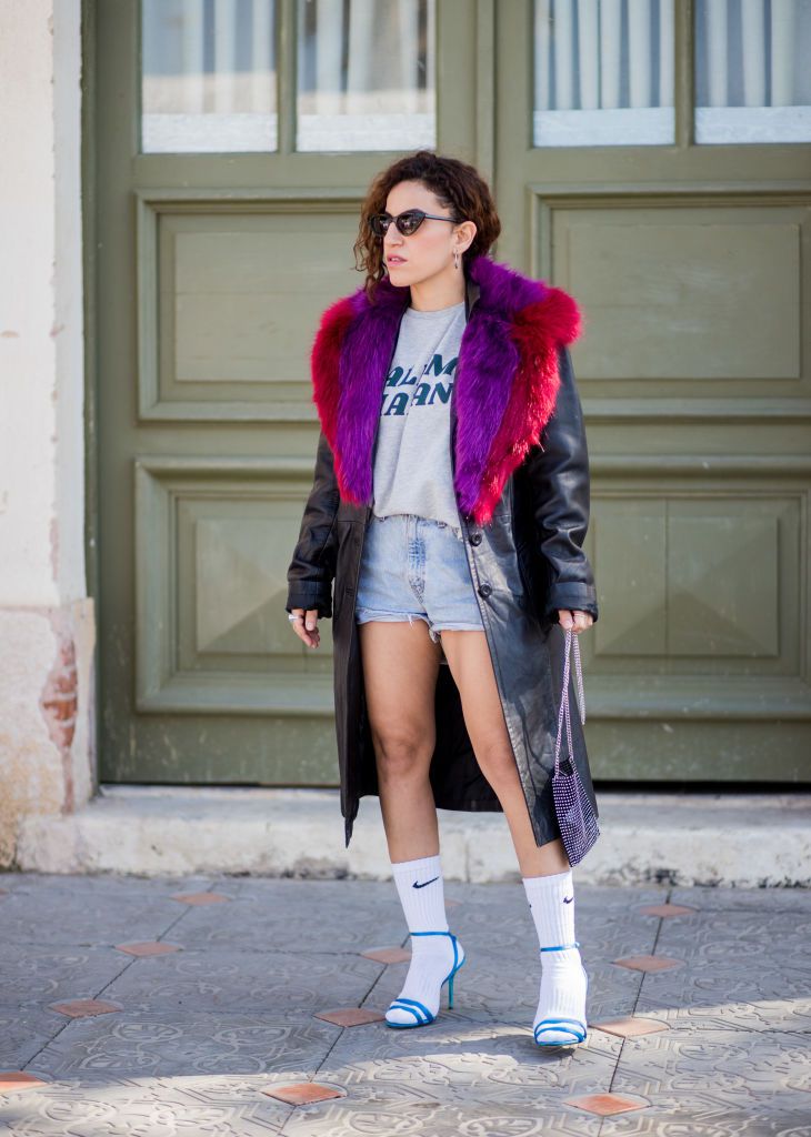 utca style outfit in faux fur leather coat and jean shorts