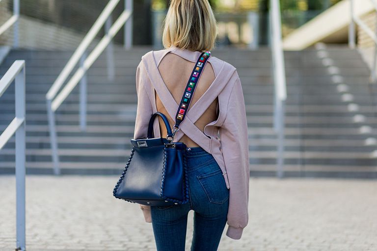 utca style woman in jeans and backless sweater