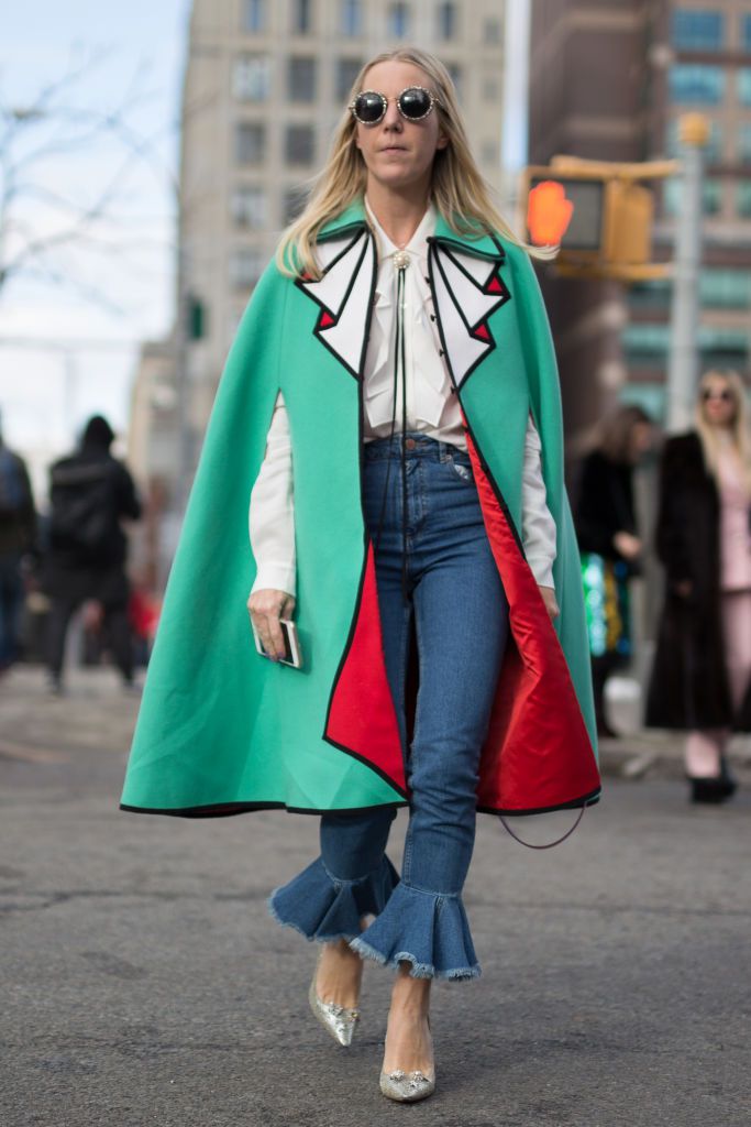 רְחוֹב style woman in cape and jeans