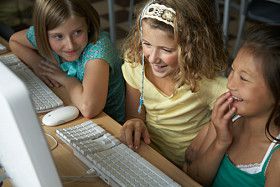 Trei Girls Using a Computer