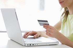 bir woman shops online with a credit card