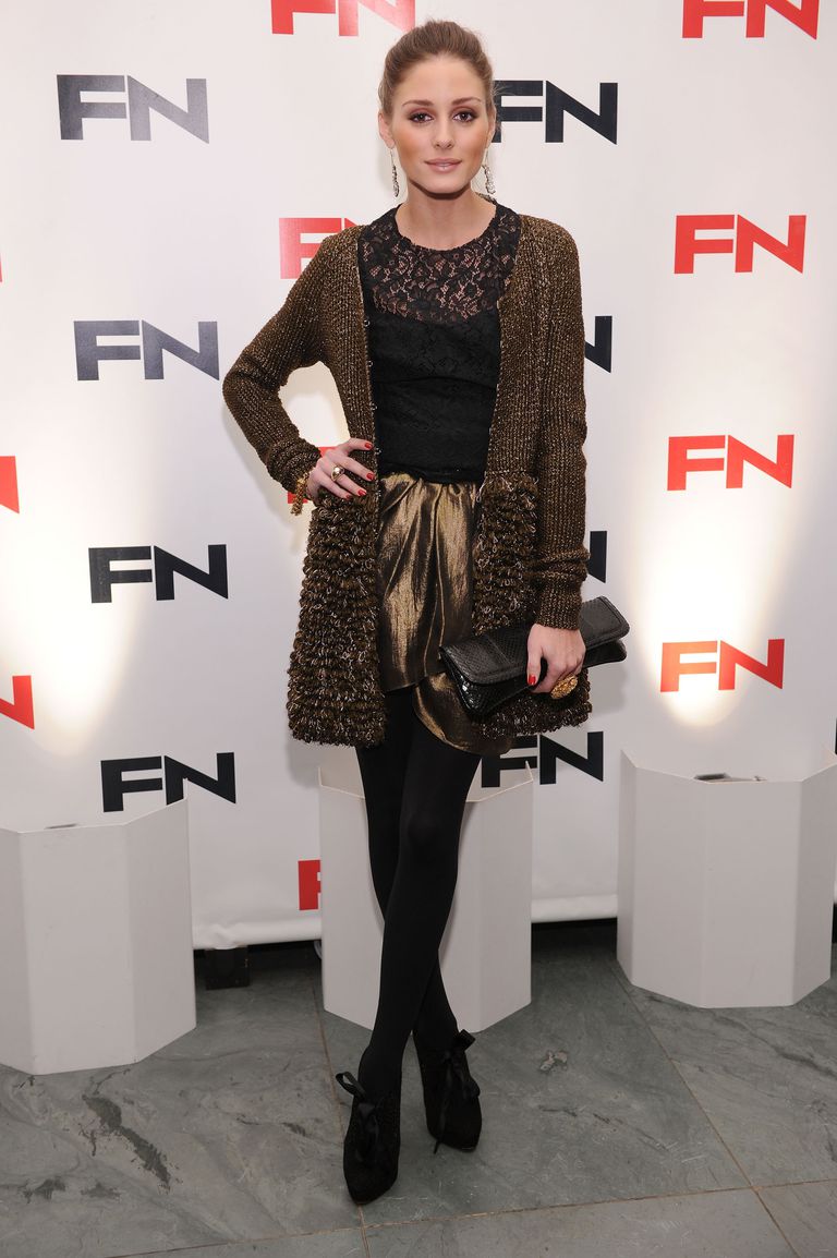 Оливиа Palmero wearing a textured cardigan and dress with tights.