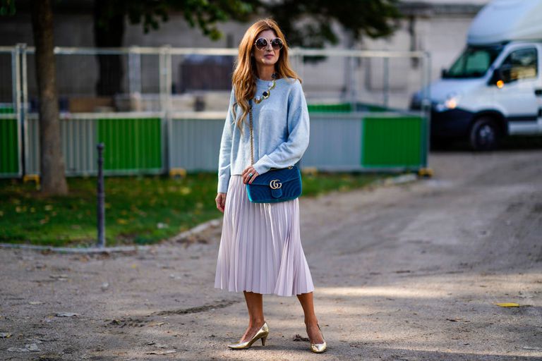 אִשָׁה wearing blue sweater and purple pleated skirt for street style fashion