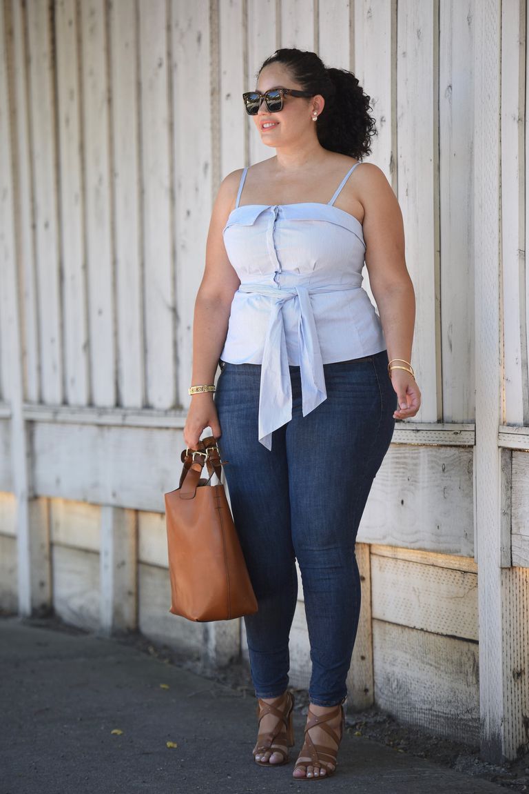 Curbat woman in jeans and a strapless top