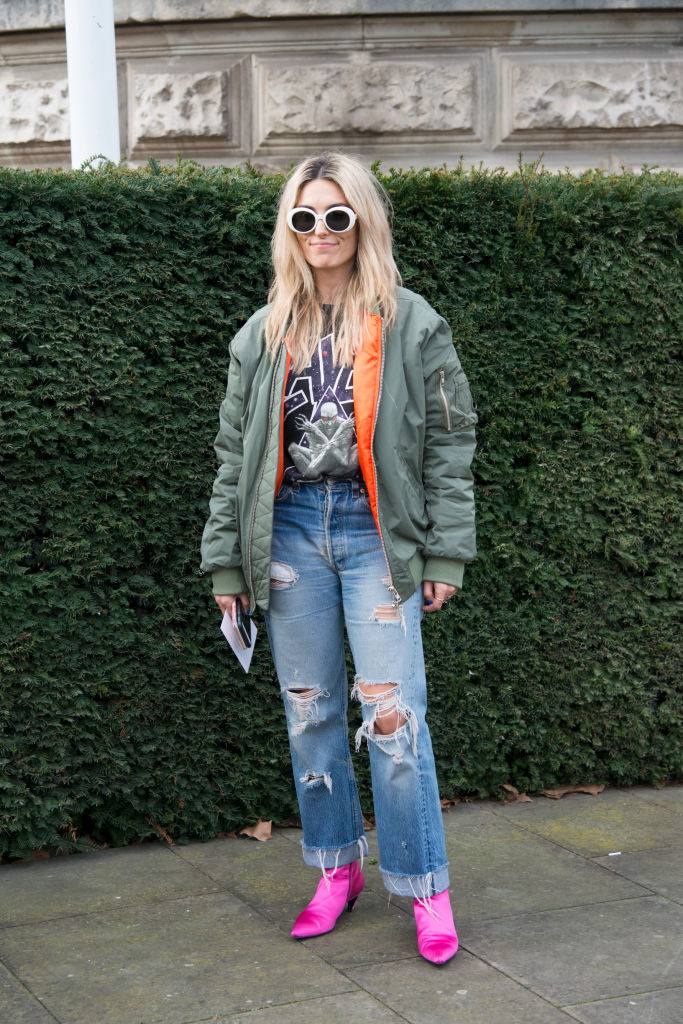 फट jeans and green bomber jacket