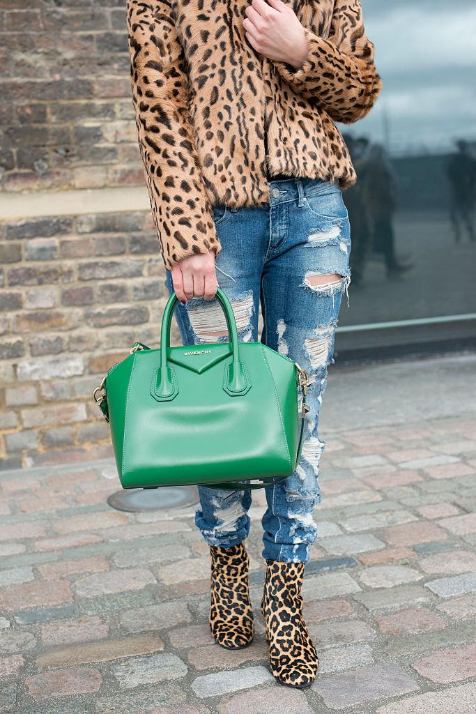 Ulica style photo of woman wearing leopard print and distressed jeans