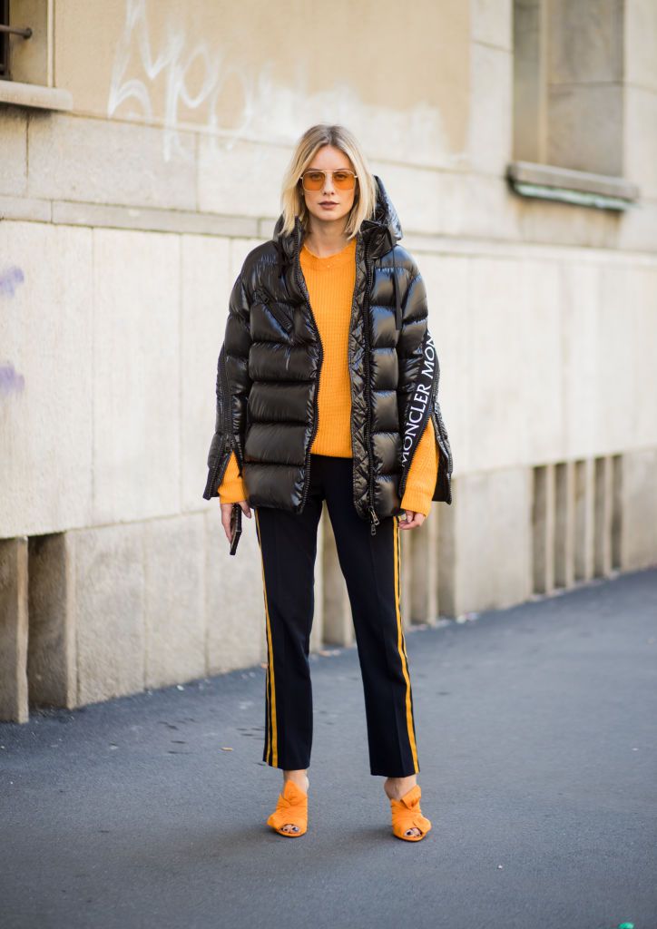 Sportig style in a puffer jacket and sweater
