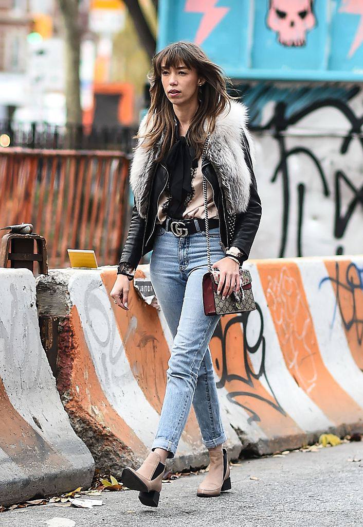 Stradă style in leather jacket and jeans