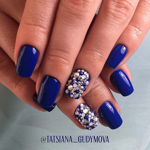 Bold Blue Nail Design with Rhinestones