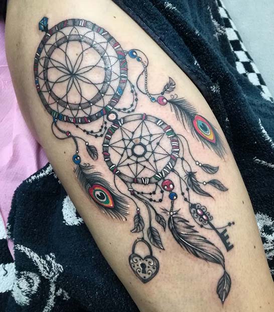 Sanj Catcher Tattoo with Peacock Feathers