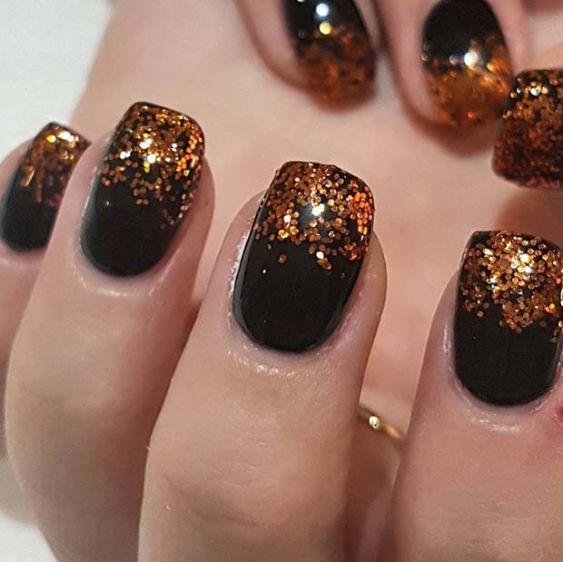 Crno and Orange Glitter Nails for Winter Nail Ideas
