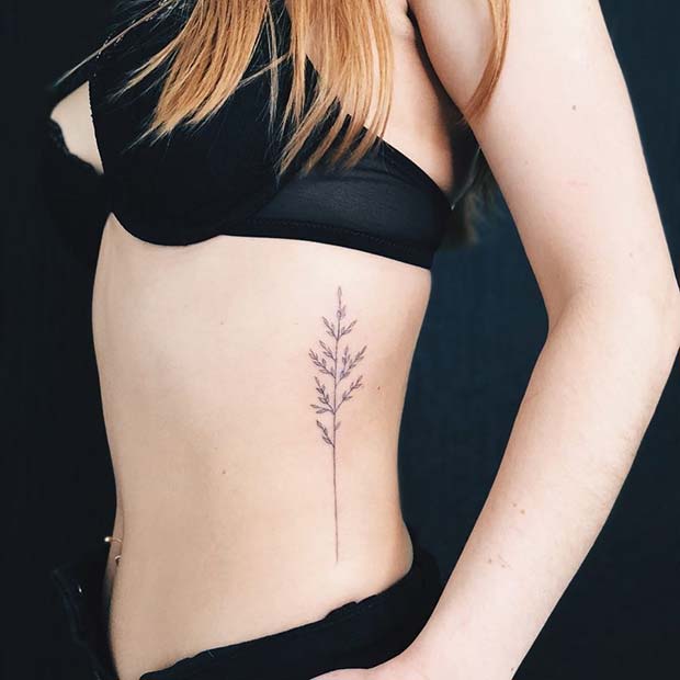 सुंदर Botanical Rib Tattoo Idea