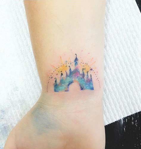 קָטָן Watercolor Disney Castle Wrist Tattoo