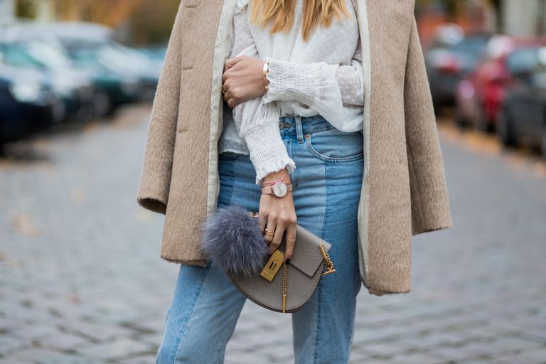 Ulica style woman in jeans and a coat