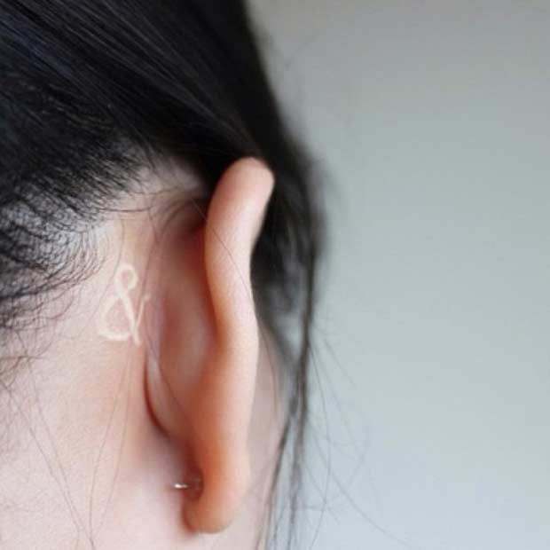 Mögött the Ear White Ink Tattoo