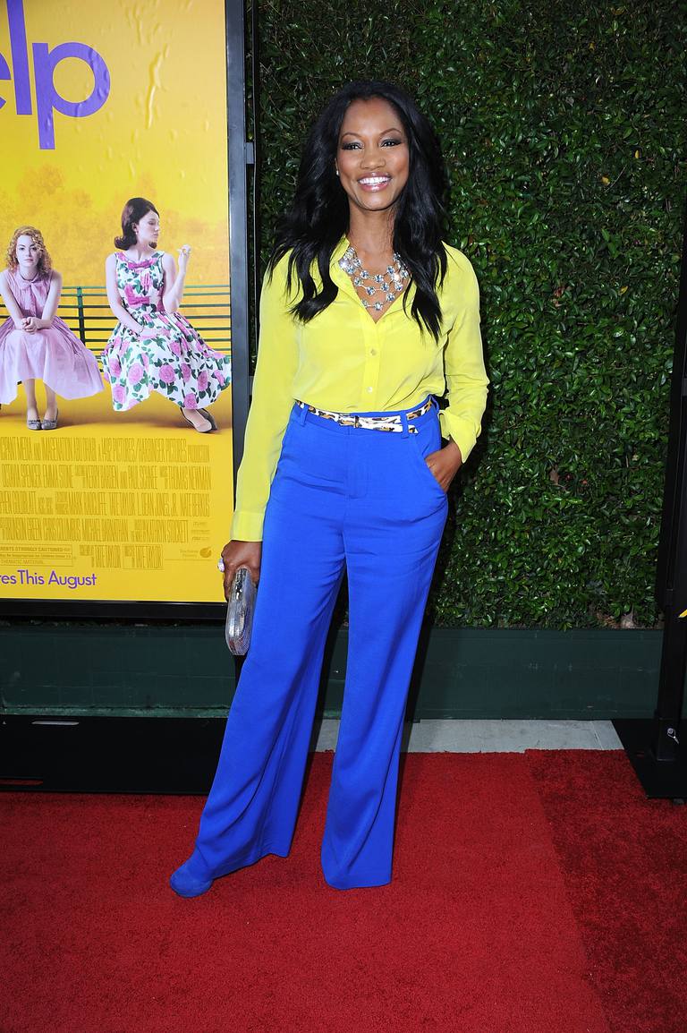 Garcelle Beauvais in cobalt pants and yellow top.