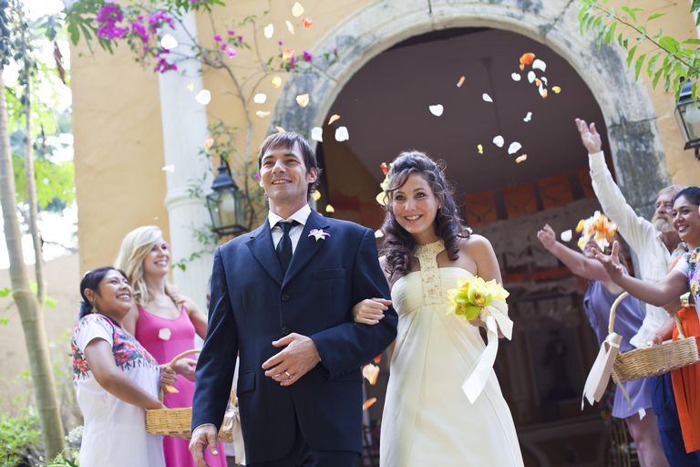 Gelin and groom outside chapel in Mexico