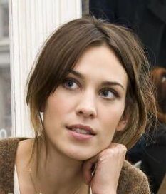 Alexa Chung in her signature mussy updo