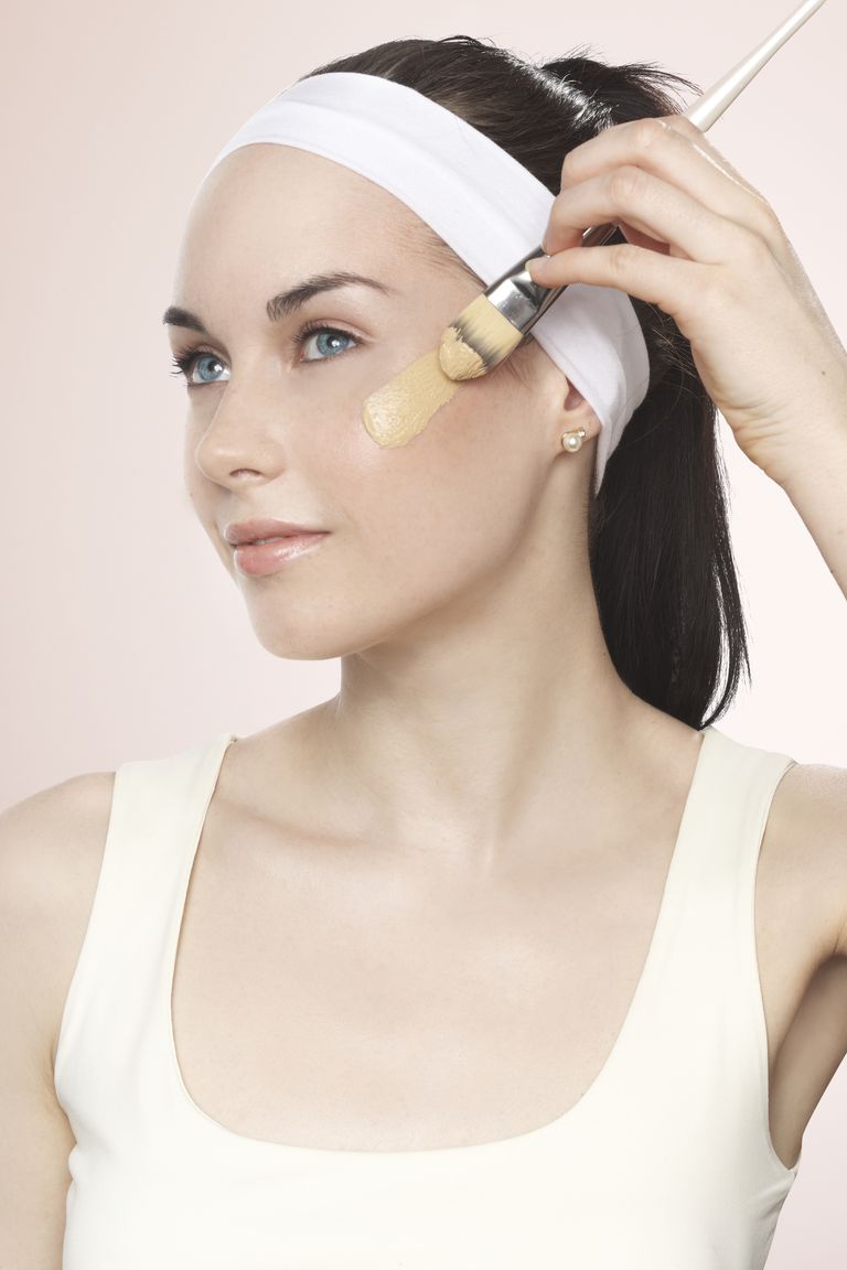 Ung lady applying a swatch of foundation