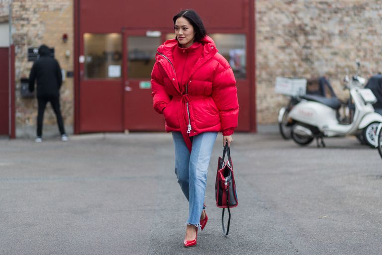 utca style in a red puffer coat and jeans