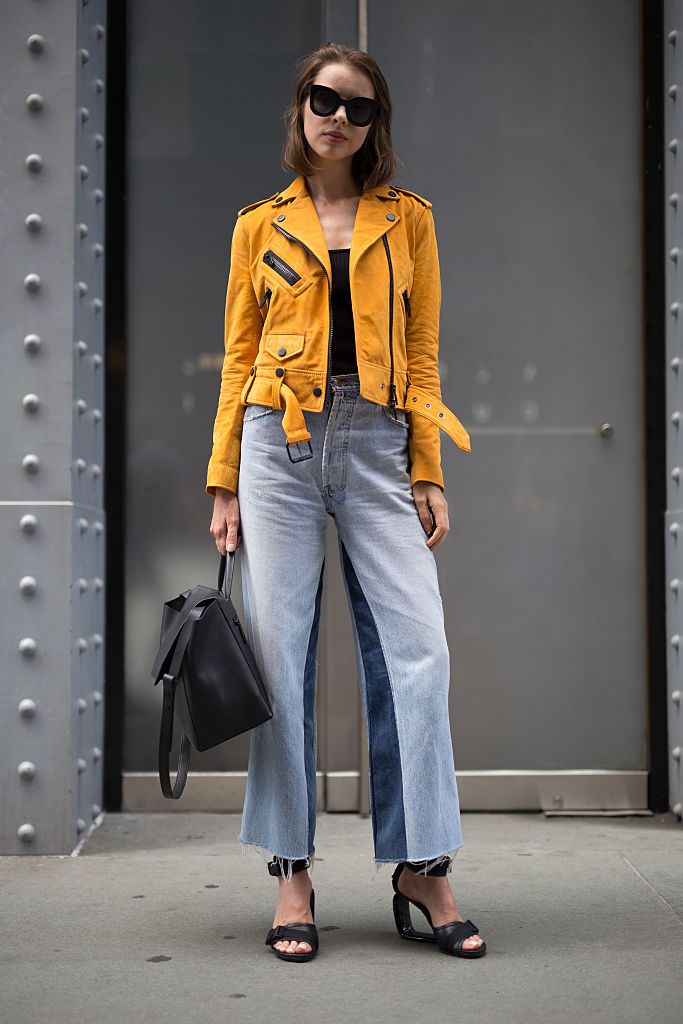 Ulica style in wide leg jeans and a leather jacket