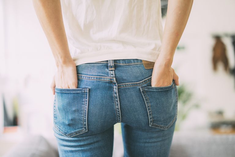ด้านหลัง view of woman wearing jeans