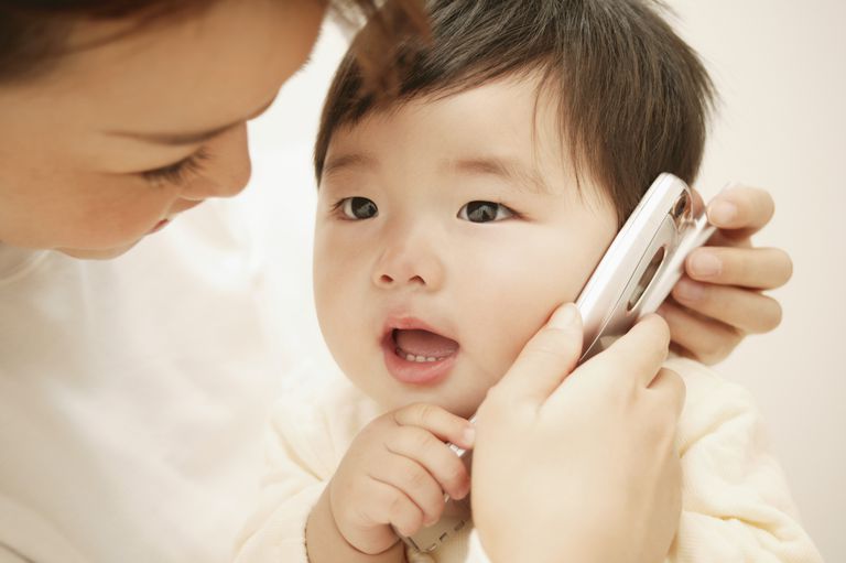  Baby Playing with a mobile phone talking to grandparents